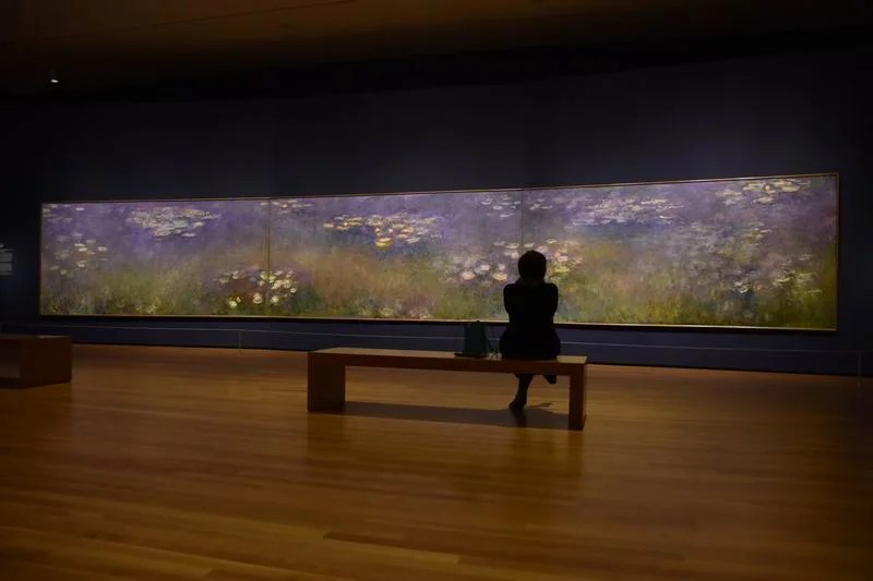 The Nelson-Atkins and the St. Louis Art Museum have loaned their Waterlilies by Monet to the CMA so that the three images could be joined together again.