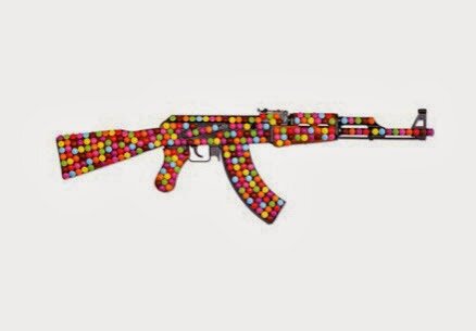 AK 47 Kalashnikov, multicolor original gun with applied Smarties by Kata Legrady from her Guns and Candies series.